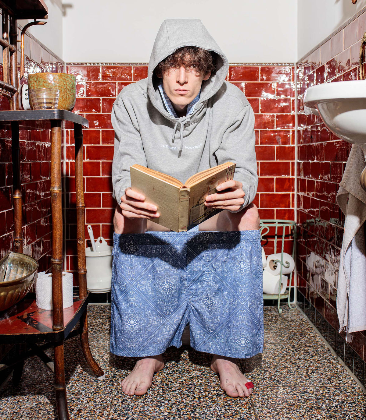 Model wearing blue Paisley boxer shorts by Pockies